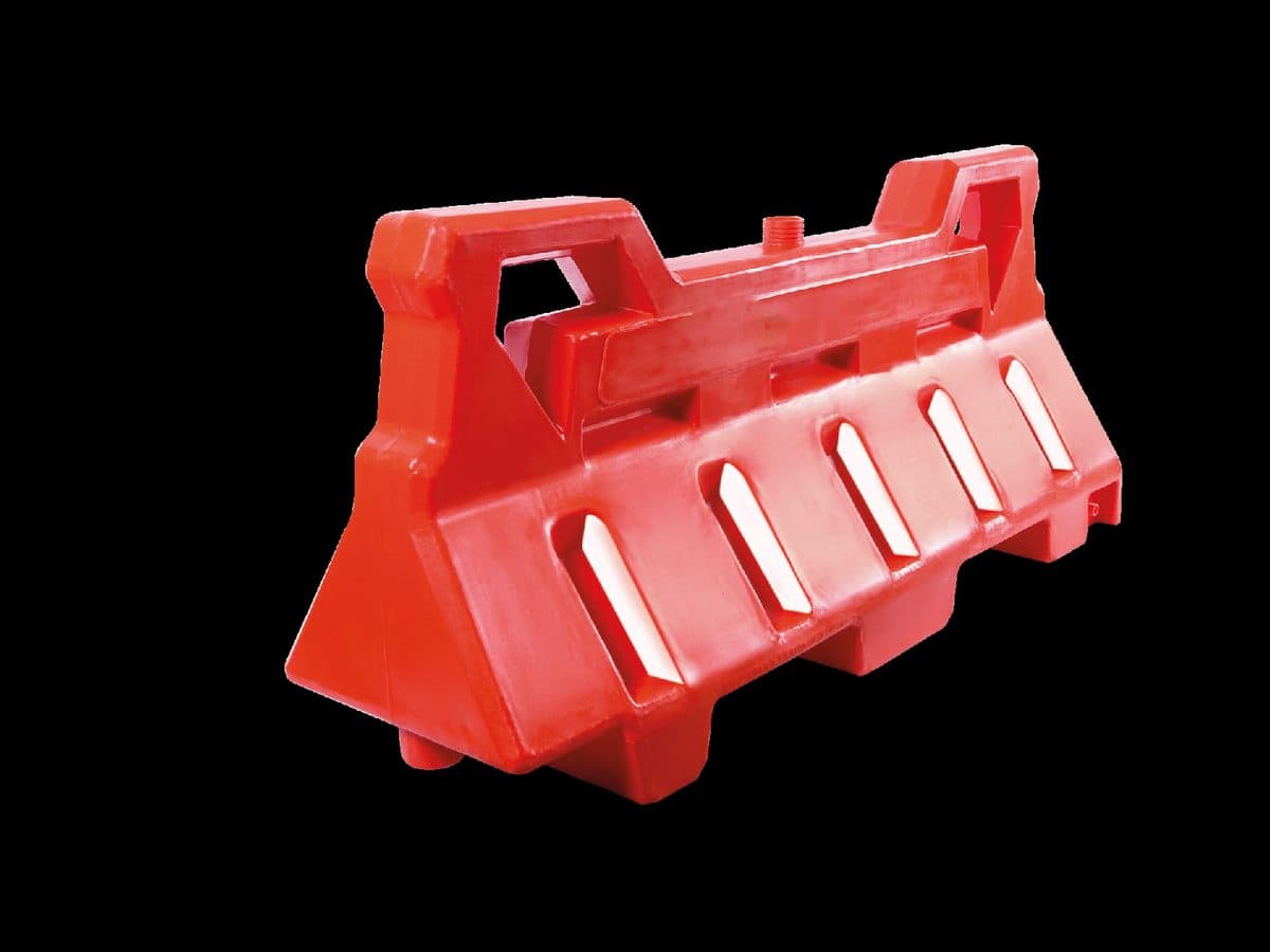 Orange water-filled polyethylene traffic barrier